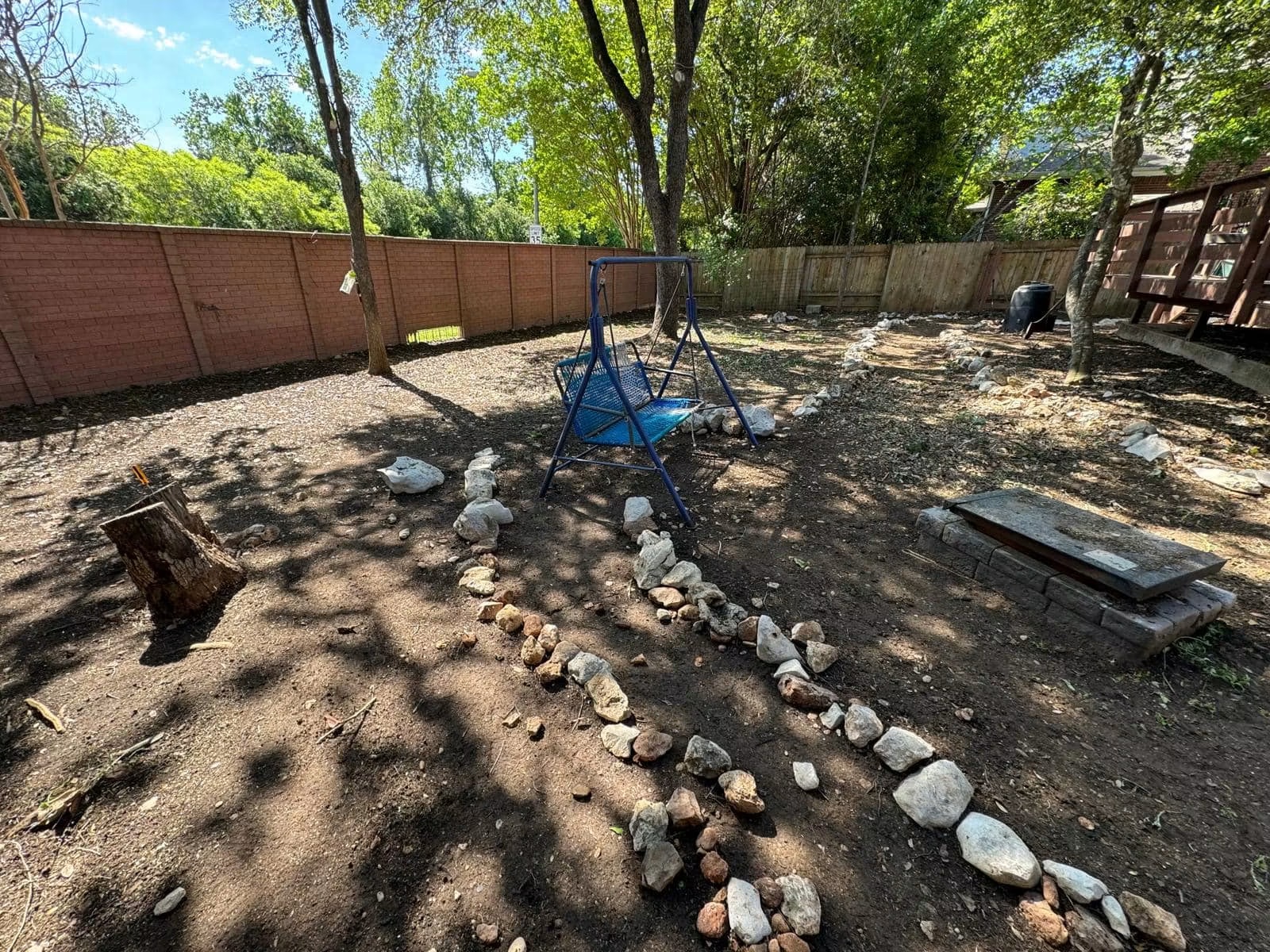 Bare backyard before the full landscape installation
